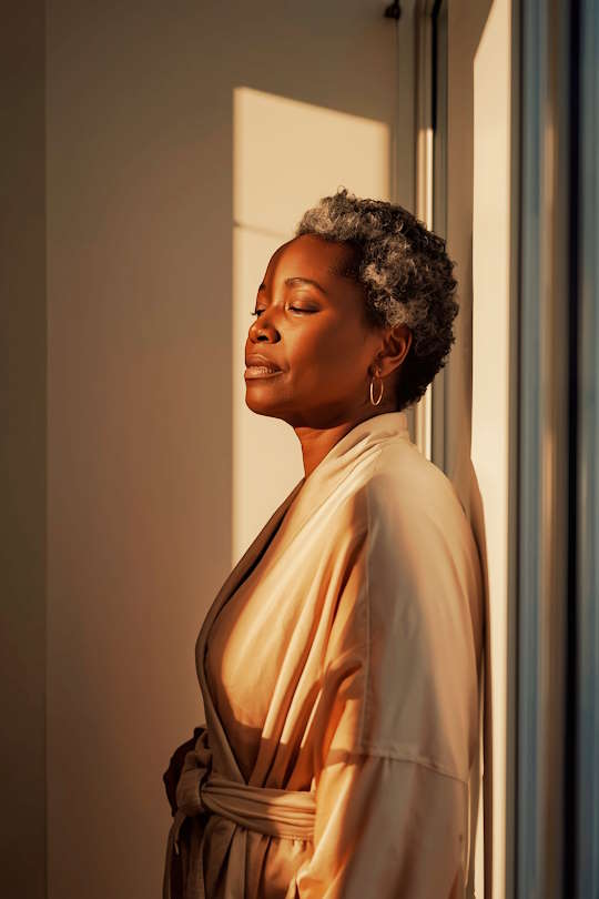 Woman in natural light representing hormone health and HRT telehealth options