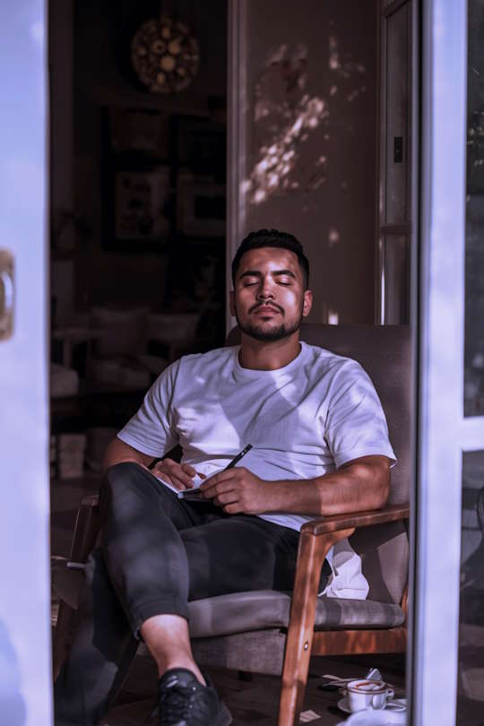 Person in a calm outdoor setting representing online therapy and mental health support